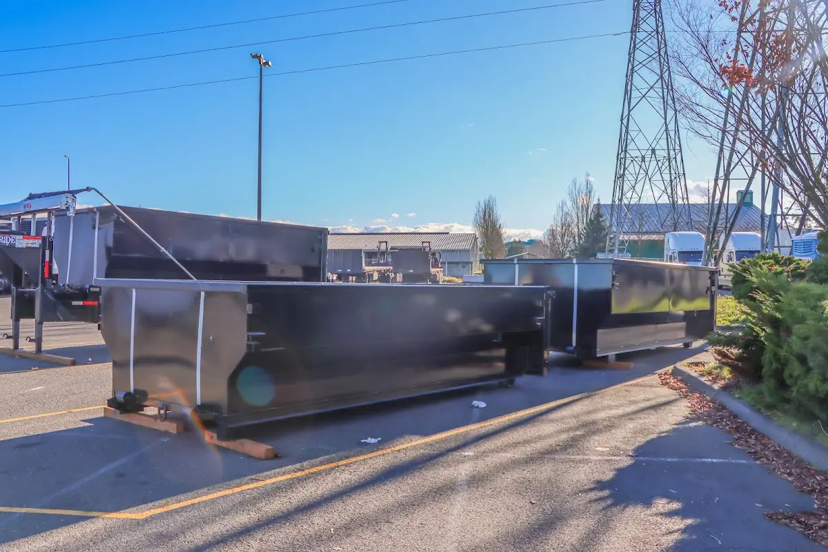 Roll-off dumpster ready for waste disposal at job site for Yard Waste Dumpster Rental in Mason City